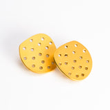 Perforated Circle Earrings in Gold Plated Steel. Sterling silver ear wires.